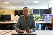 © ReeldealHD images - Businesswoman with headset on a video call in an office talking to camera looking to camera