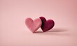 © Dmitriy - Two velvet heart-shaped pillows on a pink background