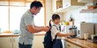 © Reubens Stock Photos - Loving Asian Father Helping Daughter Get Ready for School in the Morning
