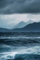 Wall Mural - A large body of water with a stormy sky above it. The waves are crashing against the shore, creating a sense of power and energy