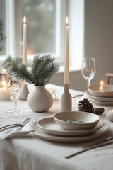 christmas dinner table setting in white tones with beautiful christmas decorations