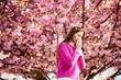 © anatoliy_gleb - Woman allergic suffering from seasonal allergy at spring in blossoming garden at springtime. Woman sneezing and blowing nose using nasal handkerchief in front of blooming tree. Spring allergy concept.