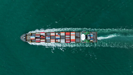 Canvas Print - logistic cargo container ship sailing in sea to import export goods and distributing products to dealer and consumers across worldwide, by container ship Transport business service.