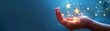 © Supath - Hand Holding Shining Stars.