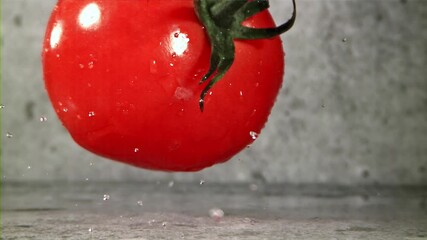 Poster - Fresh tomatoes with a splash of water. Filmed on a high-speed camera at 1000 fps. High quality FullHD footage