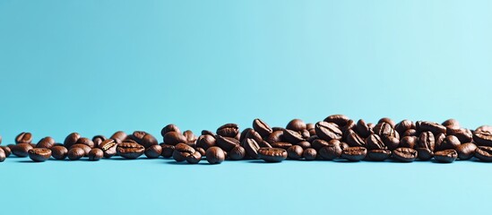 Leinwandbilder - Coffee beans on a blue background with copyspace in a coral trend