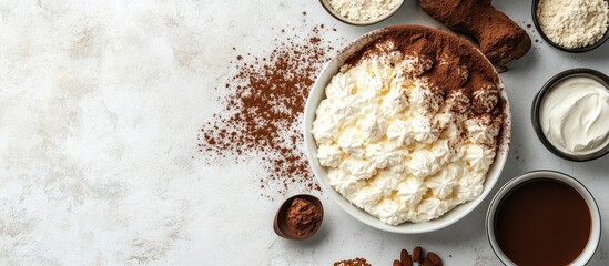 Poster - Mascarpone cheese and ingredients for creating the Italian dessert tiramisu on a light concrete surface Top view with copyspace