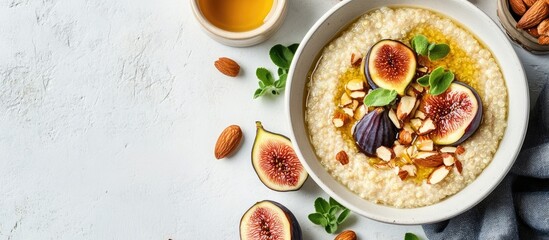 Poster - Gluten free amaranth and quinoa porridge breakfast bowl topped with figs caramelized almonds raisins and honey on a rustic white table Top view overhead flat lay Copy space