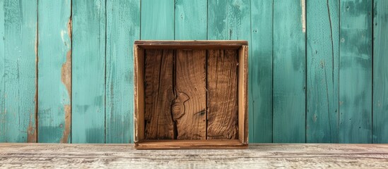 Wall Mural - Large wooden box with a divider on a light mint background empty Product display concept Copyspace Oak box positioned on the table for setup Vertical image