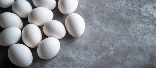 Leinwandbilder - Fresh white eggs on a gray background Top view A rural still life featuring natural organic healthy food with available space. with copy space image. Place for adding text or design