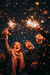 © Miljan Živković - friends celebrate new year on the party at winter and hold fireflies