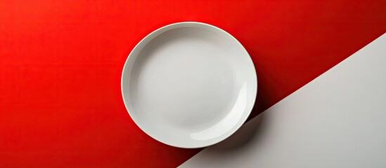 Aufkleber - Top view of an empty white plate against a white and red backdrop. with copy space image. Place for adding text or design