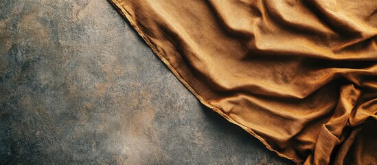 Poster - Top view of a vacant brown tablecloth on a cement surface featuring copy space