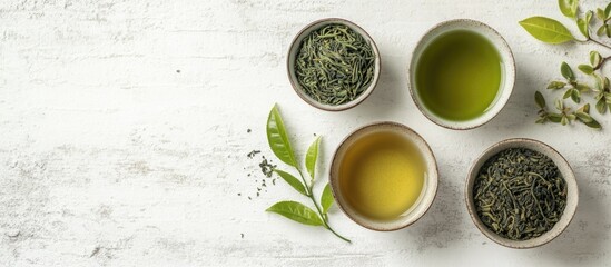 Poster - A selection of green tea in a ceramic cup set against a white textured background Top view Copy Space