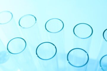 Laboratory test tubes on colored background