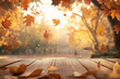 © 수동 김 - Wooden table with an autumn background and blurred golden-yellow bokeh light, with falling leaves in the air