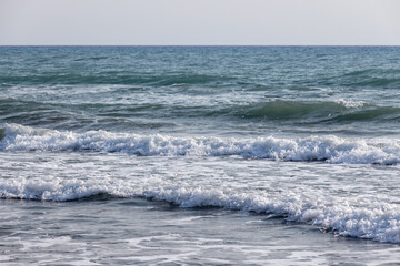 Shore sea water with waves and foam