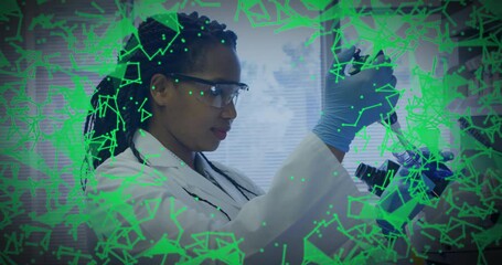 Sticker - Animation of scientific data processing over african american female scientist in laboratory