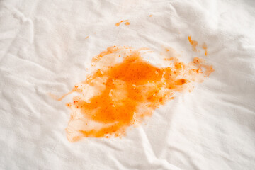 Dirty tomato sauce stain or ketchup on cloth to wash with washing powder, cleaning housework.