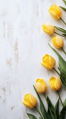 Canvas Print - Yellow tulips on white wooden surface, spring