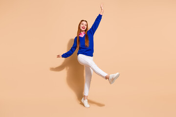 Poster - Full size photo of nice young woman enjoy dance wear pullover isolated on beige color background