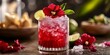 © jambulart - Red cocktail with hibiscus flower and lime.