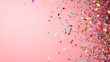 © Galib - Colorful confetti on a pink background.