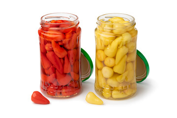 Wall Mural - Glass jars with pickled red and yellow mexican  peppers isolated on white background close up