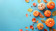 © mahamad - Hello Fall message with pumpkins on a blue background.
