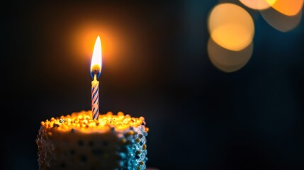 Sticker - A lit birthday candle atop a decorated cake, symbolizing celebration and wishes.