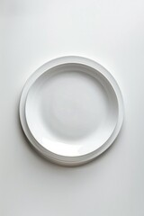 Poster - A single white plate sits atop a table with a simple background