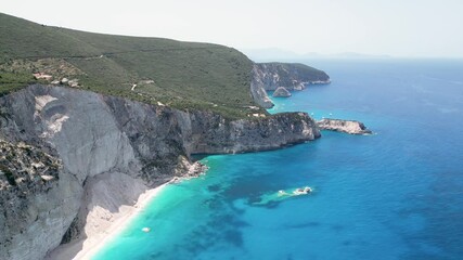 Sticker - Drone scenery of the rocky steep shores of the Greek island of Lefkada with blue sea and misty sky