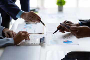 Wall Mural - Meeting of business executives discussing analysis of the company's financial situation and business planning with partner collaboration and consultation of strategy.