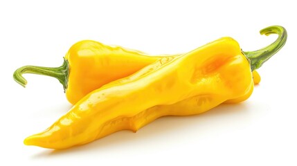 Canvas Print - Two yellow peppers sit together on a white surface