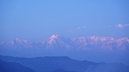 Wall Mural - Time-lapse footage of the snow-capped peaks of Panchachuli of the Himalayan at sunset, India