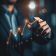 © zz - Businessman Interacting With Upward Trending Financial Graph in Office Setting