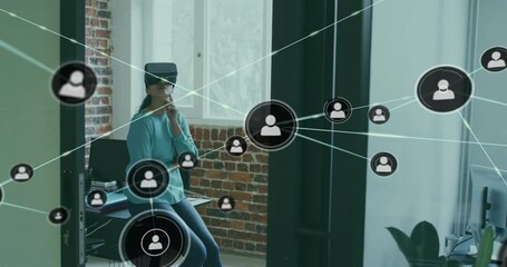 Poster - Animation of network of connections with icons over biracial businesswoman using vr headset