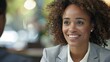 © MD Media - Woman in professional attire, smiling with confidence during an job interview. Candidate best top applicant