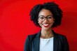 © MUdaylah - Portrait of a african american businesswoman smiling against red background. casual business, technology and office concept with generative ai