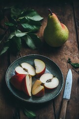 Fresh pear fruit cut on cutting board with knife