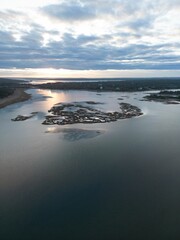 Wall Mural - Aerial view of coastal landscape with islands at sunset.