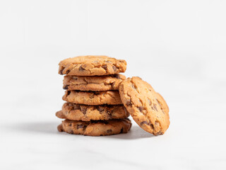 Wall Mural - stacked chocolate chip cookies on white background