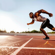 © Stock Clipart Group - Black athlete running and exercising on track