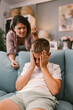 © ciric_velibor - Frustrated Mother Yells as Son Hides Face in Hands