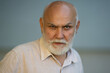 © Volodymyr - Old man with Grey hair and white beard. Bearded Senior man. Face of bearded senior age man. Headshot of bald pensioner, retiree concept. Closeup portrait of an old mature senior man with grey beard.