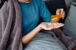 © aksonsat - Sick woman is taking pills and water for helping healing illness as per prescription from doctor and pharmacy