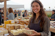 © Peeradontax - A cheerful woman wearing an apron smiles while holding a handcrafted bar of soap at an outdoor market.