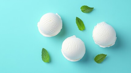 Wall Mural - Three scoops of vanilla ice cream with mint leaves on turquoise background.