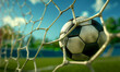© IBEX.Media - Soccer ball caught in the net with a dynamic background, symbolizing the excitement and precision of scoring a goal in a match
