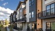 © Pascal - The exterior facade of a contemporary multifamily building featuring Hardie plank siding